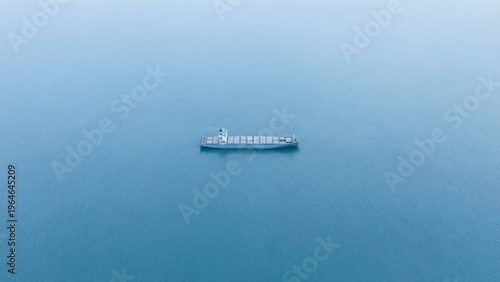 Cargo Ship Sailing Peacefully on the Vast Blue Ocean
