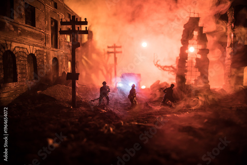 War Concept. Military silhouettes fighting scene on war fog sky background. Sappers clears mines at the site of recent fighting zone. Battle in ruined city.