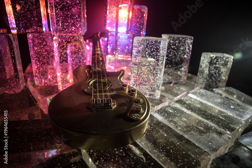 Music Concept: Guitar Miniature on a Dark Background with Vivid Light, Smoke, and Fire Effects. Golden electro guitar under a Dramatic Spotlight.