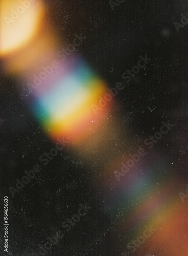 Quadro su tela Rainbow light leak prism effect on dark vintage film grain texture