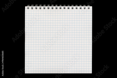 Spiral graph grid notepad page in vertical layout on black background