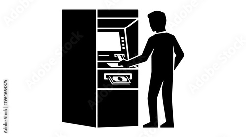 "Silhouette of person using ATM machine"