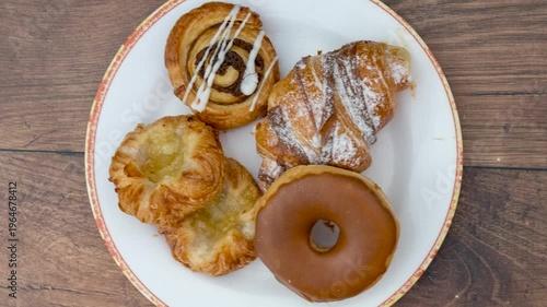 Rotating Plate of Sweet Pastries, Danishes and Donuts