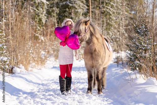 Happy Valentine's Day horse and rider with pink heart shaped shiny balloons.