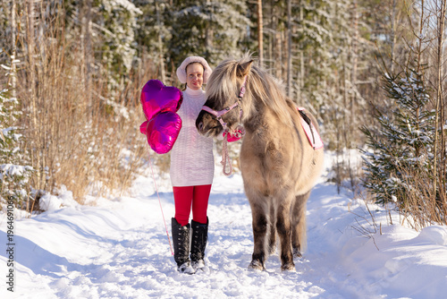 Happy Valentine's Day horse and rider with pink heart shaped shiny balloons.