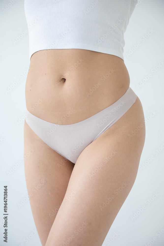 Fototapeta premium Close-up of beige underwear on a woman