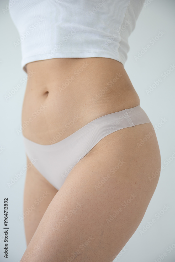 Fototapeta premium Close-up of beige underwear on a woman