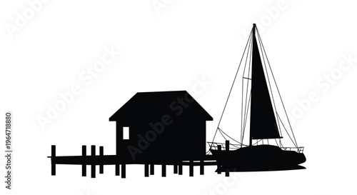 Coastal scene featuring a sailboat and house in dark silhouette