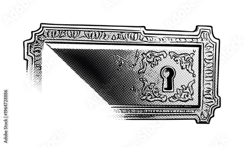 An old cabinet lock plate with heavy baroque decoration and embossed ornamental borders, partially cropped at the frame edge for dynamic composition, black and