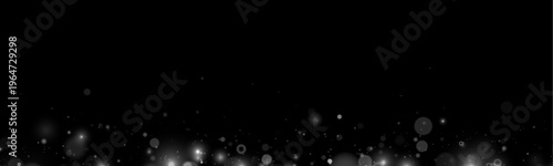 Shimmering dust particles form a luminous abstract pattern. Soft bokeh adds depth and glow. Great for Christmas, New Year, or winter theme projects.