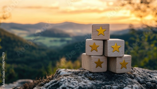 Wooden cubes with yellow stars on them, stacked in a pyramid shape against a blurred background.