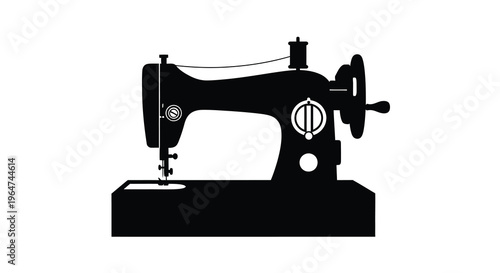 Vintage sewing machine depicted in a striking black silhouette