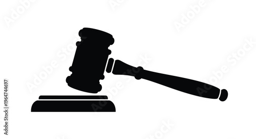 A black gavel and sounding block stark against a white background silhouette