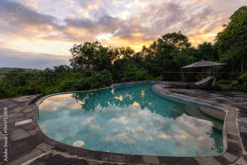 Sunrise over a peaceful secluded pool at the Galapagos Safari Camp - Highlands of Santa Cruz, Galapagos Islands