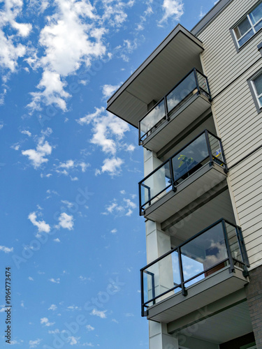 Top of residential building on blue sky background
