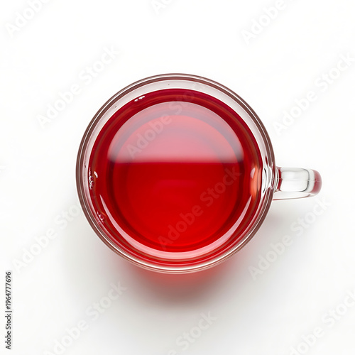Invigorating crimson herbal tea in a clear glass mug, top view, offering a moment of refreshing warmth