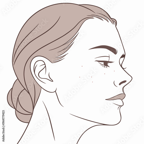 Woman's face in profile with freckles and brown hair
