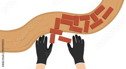 Two gloved hands are arranging multiple red rectangular bricks on a curved light brown sandy surface from a top-down perspective.
