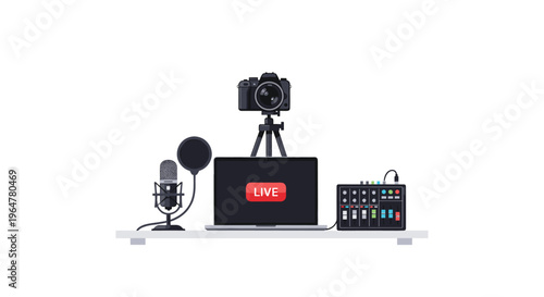 A black camera on a tripod, a laptop showing a LIVE button, a microphone with a pop filter, and a mixing console are arranged on a grey table.