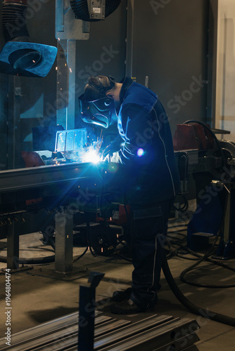 Factory welder with protective mask welding metal marts