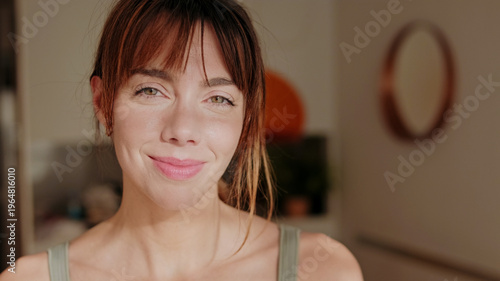 Friendly Woman Smiling At Home In Morning Light