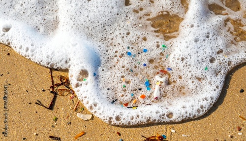 Ocean foam carrying colorful microplastic particles onto a sandy beach, symbolizing marine pollution and environmental crisis.