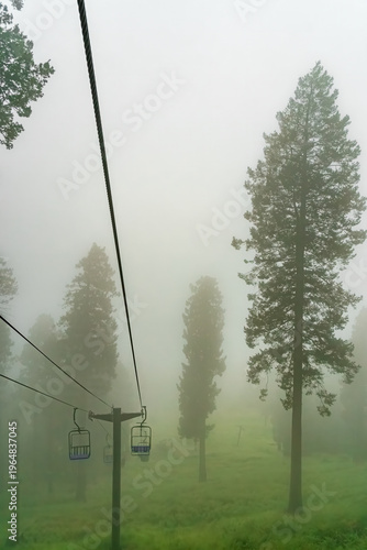 Ski lift in the clouds and fog on a summer day in the Santa Catalina Mountains near Tucson Arizona