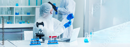 Banner Two asian scientist team reserch chemistry science tube experiment biotech antibody laboratory Cultivate Vaccine against virus. Two Scientist consulting Chemistry Laboratory with copy space