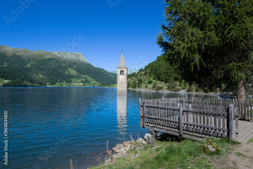 Slika na platnu Reschen See - Reschen Lake - Lago di Resia - Tower of the sunken village of Graun