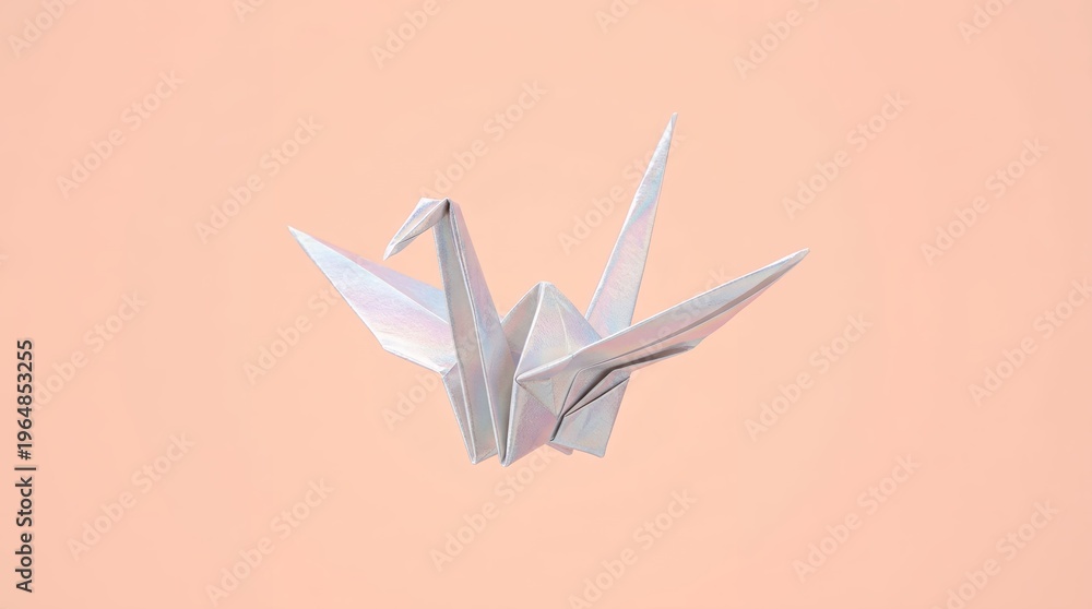 Obraz premium Elegant white origami paper crane bird on soft peach background with minimal style
