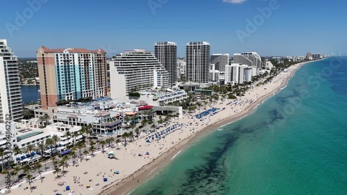 Spring breakers enjoying a sunny Ft Lauderdale Beach day near Las Olas Blvd in Broward County, Florida. 