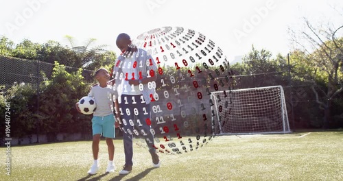 Father guiding son holding ball walking to goal causing binary sphere appearing and showing stats