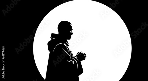 Silhouette of a praying man.