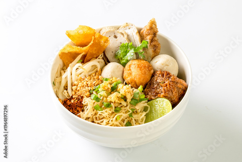 dry Chinese yellow noodles with bean sprout topping pork meatball