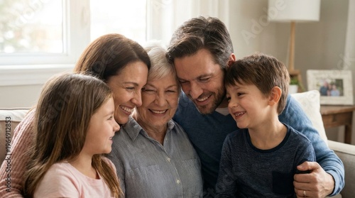 Happy multigenerational family embracing and smiling together on a sofa at home.