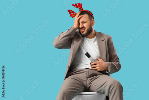 Young man in reindeer horns...