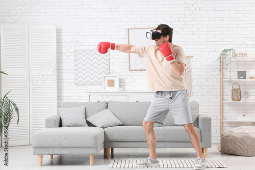 Sporty young man in VR glas...