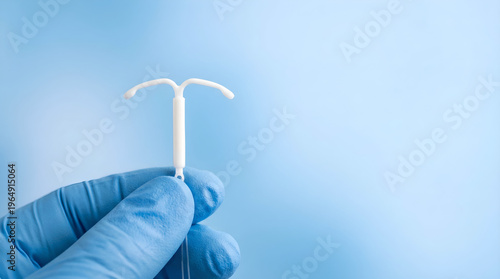 Healthcare worker presenting an intrauterine device (IUD), a key tool for long-term birth control and reproductive health planning