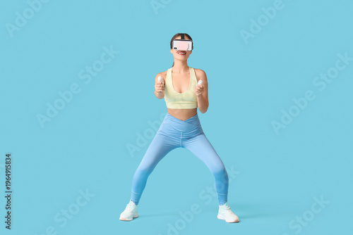 Sporty young woman in VR gl...