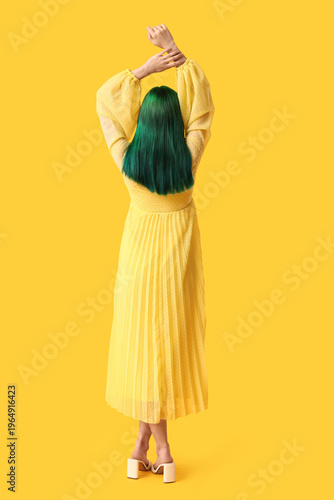 Young woman with green hair...