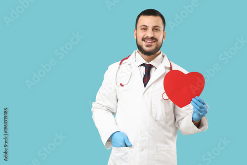 Young happy male doctor wit...