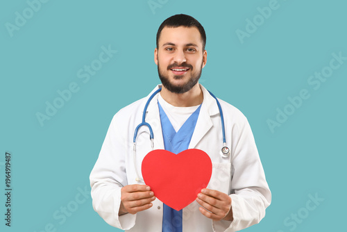 Young happy male doctor wit...