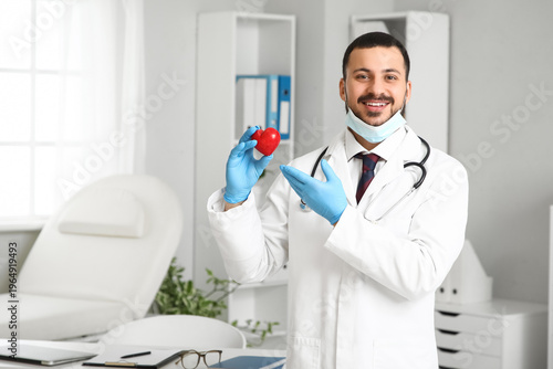 Young happy male doctor wit...