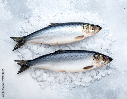 Two glistening fish sit atop crushed ice, a culinary and visual delight