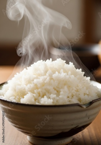 Perfect bowl of fluffy white rice with gentle steam rising, closeup view