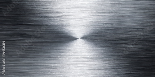 A polished silver stainless steel plate with a brushed metal texture creates a dark gray industrial pattern on a shiny metallic surface reflecting light