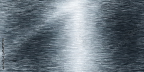 Polished stainless steel plate with a brushed metallic texture and shiny silver gray reflections on an industrial chrome aluminum surface pattern