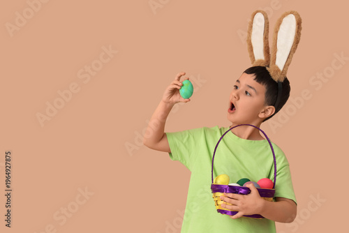 Surprised little boy in bun...