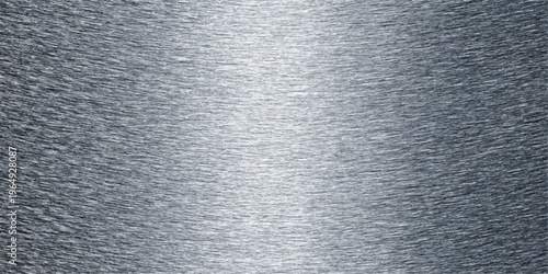 Brushed silver stainless steel plate with a shiny metallic aluminum texture and gray alloy pattern creates a sleek reflective material background for a modern grey wallpaper sheet