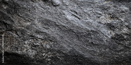 A weathered and old stone wall background reveals a rough natural rock texture with a grey mineral structure and grunge surface pattern